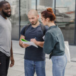 people-signing-documents-together